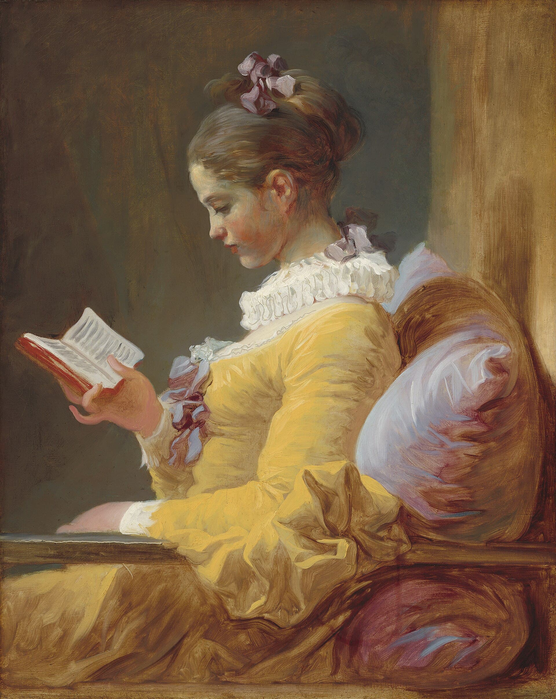 Jean-Honoré Fragonard, Czytająca dziewczyna, około 1769, olej na płótnie - młoda kobieta ujęta z profilu, w jaskrawej szafranowożółtej sukni z białą krezą, siedzi wsparta o poduszkę i z pełnym skupieniem czyta niewielką książkę trzymaną w prawej dłoni; ciepłe, miękkie światło i swobodne pociągnięcia pędzla oddają spokój zatopienia w lekturze