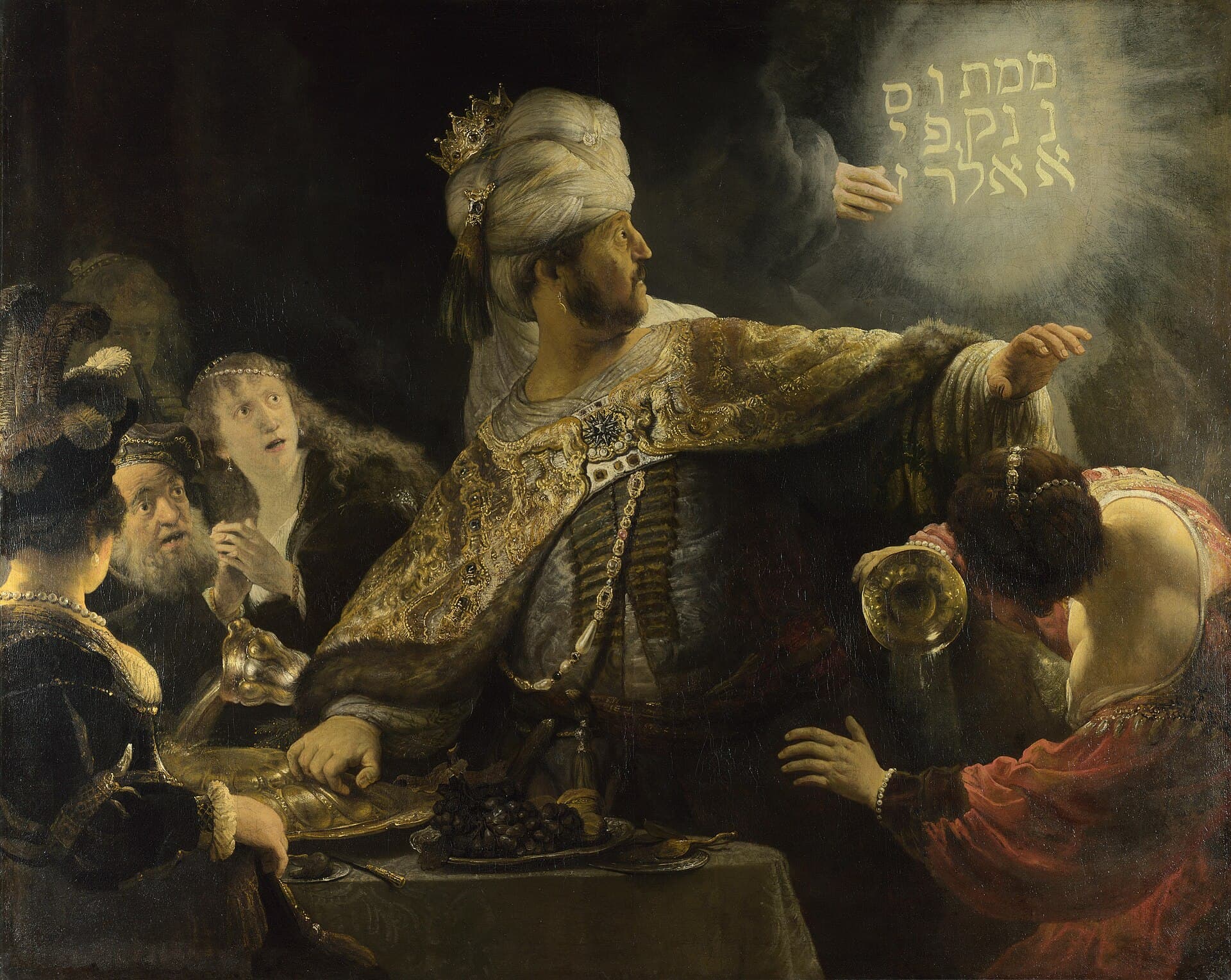 Rembrandt, Uczta Baltazara ok. 1635-38, National Gallery - w mroku rozświetlonym złotem babiloński król Belzazar w bogatym płaszczu i turbanie odwraca się z wytrzeszczonymi oczami od świetlistej dłoni, która kreśli na ścianie hebrajski napis; biesiadnicy w popłochu, a król nie rozumie, że czyta własny wyrok