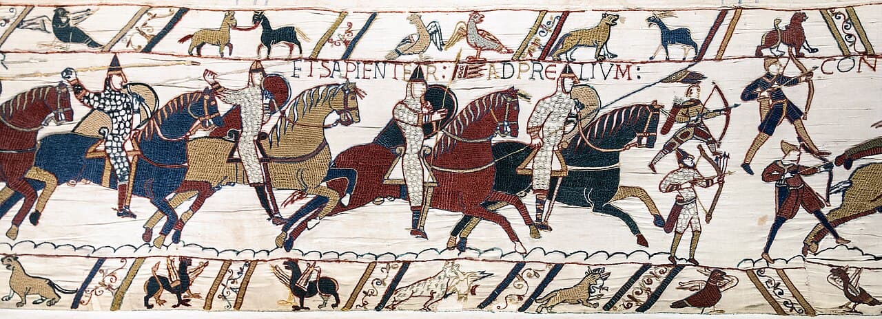 Tkanina z Bayeux, scena 51 (ok. 1070) - haftowany pas z rycerzami i łucznikami, opowieść biegnie w kolejnych, sąsiadujących odcinkach